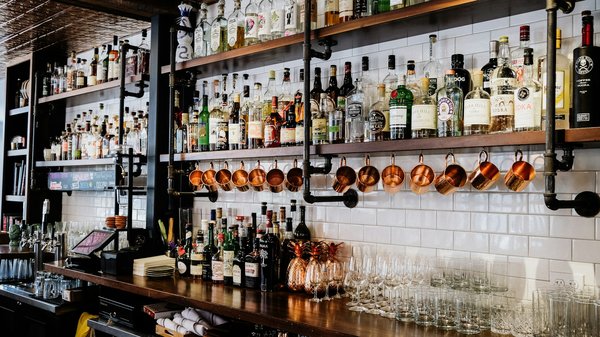 What are the key steps in successfully transitioning a traditional bar to a more modern cocktail lounge?
